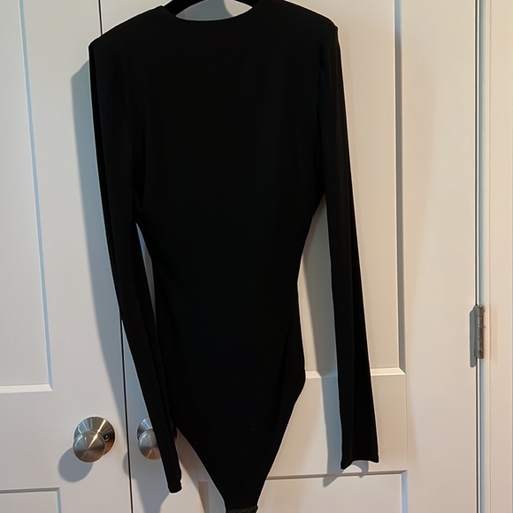 Like new. Classic deep v body suit. Padded shoulder for added detail - Picture 2 of 4